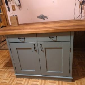 gray-blue kitchen island with wood top