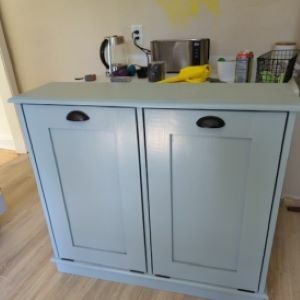 grayish blue trash bin cabinet