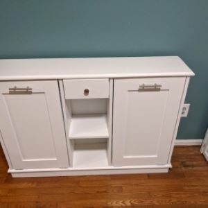 White cabinet with shelf in the middle