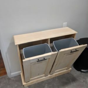 tan cabinet with bins open