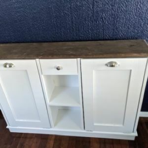 white cabinet with shelf in middle and wood top
