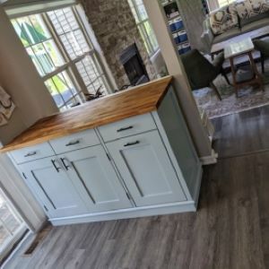 white kitchen island with wood top