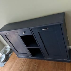black cabinet with shelf in middle