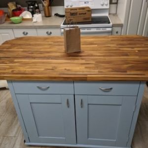 blue-gray kitchen island with wood top