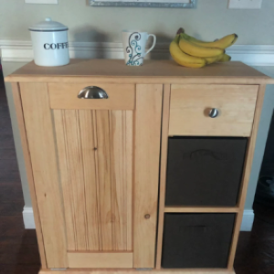 cabinet with coffee, coffee mug, and bananas