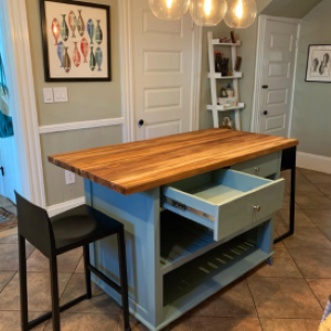 blue kitchen island with chair and open drawer