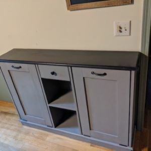 purple cabinet with shelf in middle