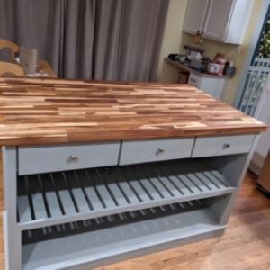 blue kitchen island with wood top